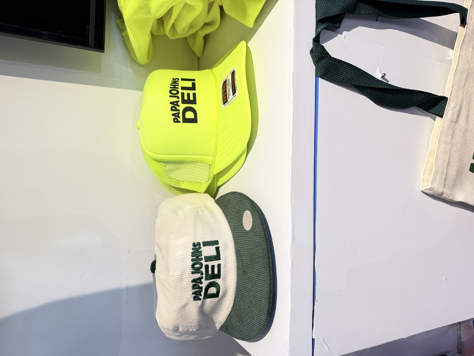 Finished shirts, hats, patches, and event merch for On-Demand T-Shirt Printing